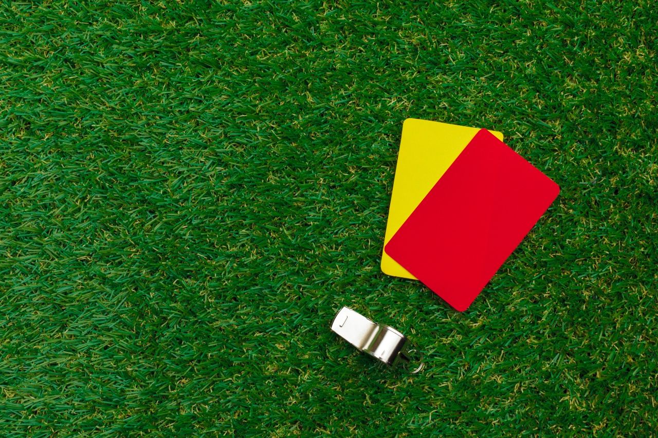 two-penalty-cards-whistle-referee_1_0.jpg