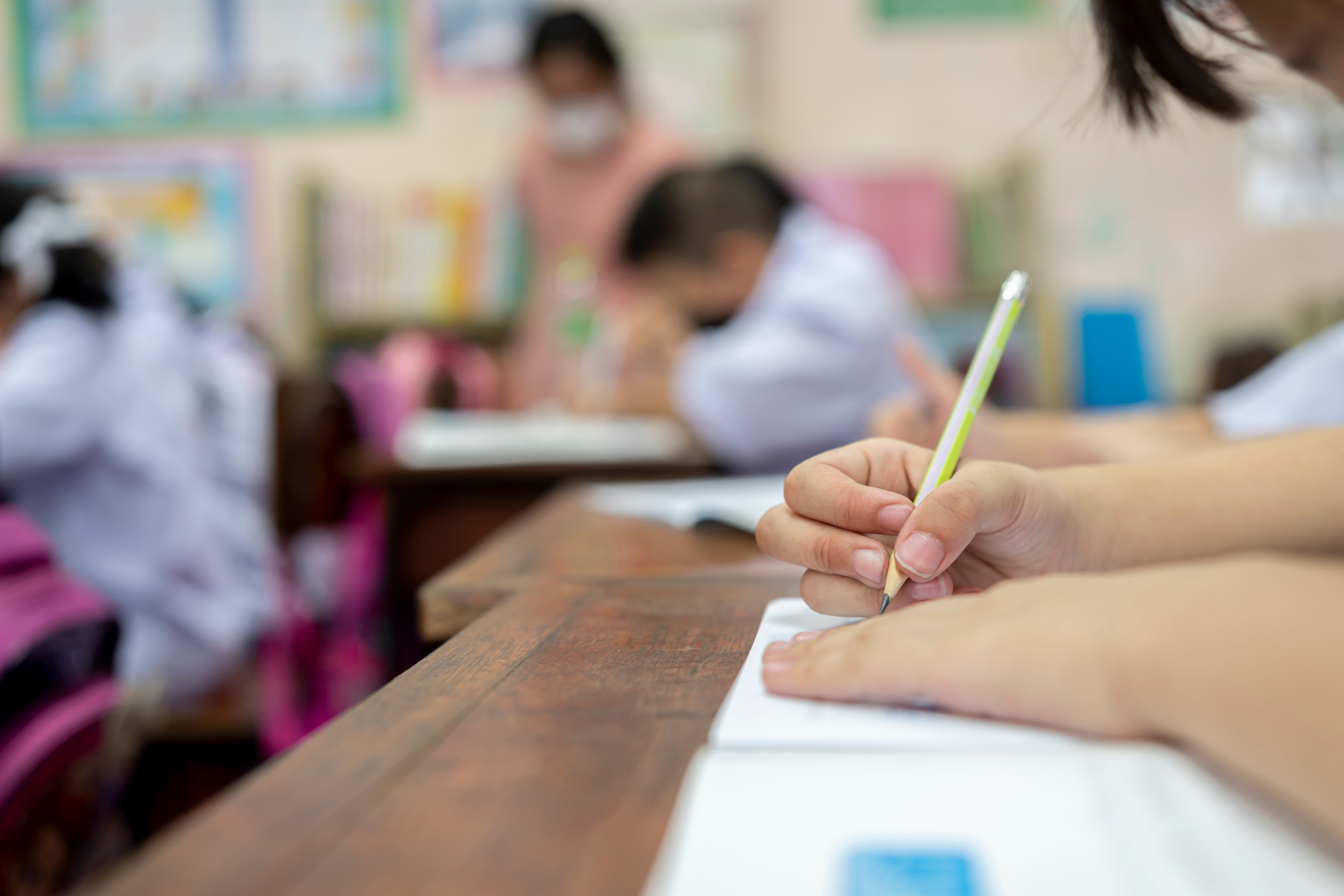 school-girl-sitting-school-writing-book-with-pencil-studying-education-learning-asian-children-class-student-diversity.jpg