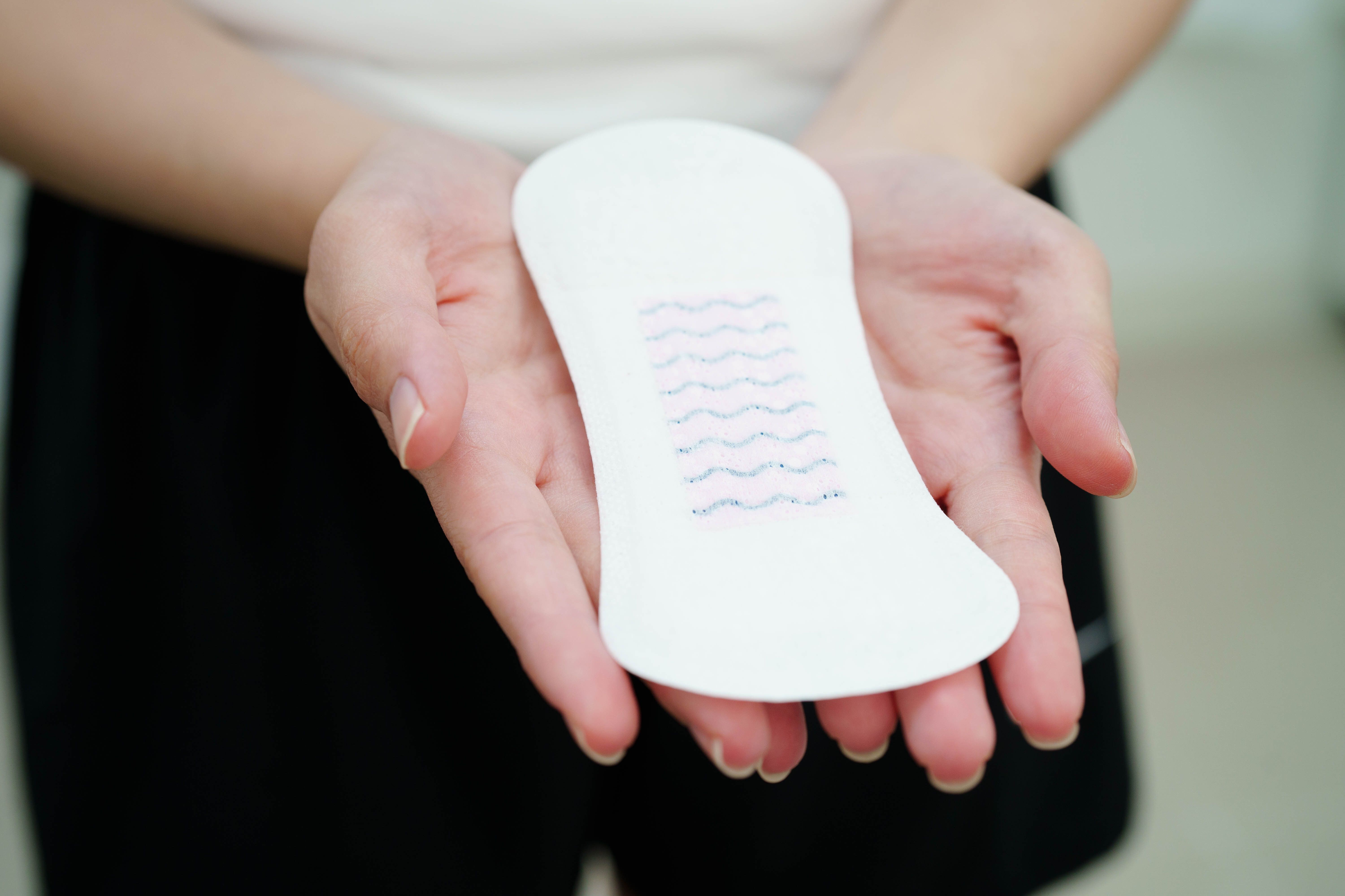 asian-woman-holding-sanitary-napkin-pad-hygiene-menstrual-period-cycle-protection.jpg
