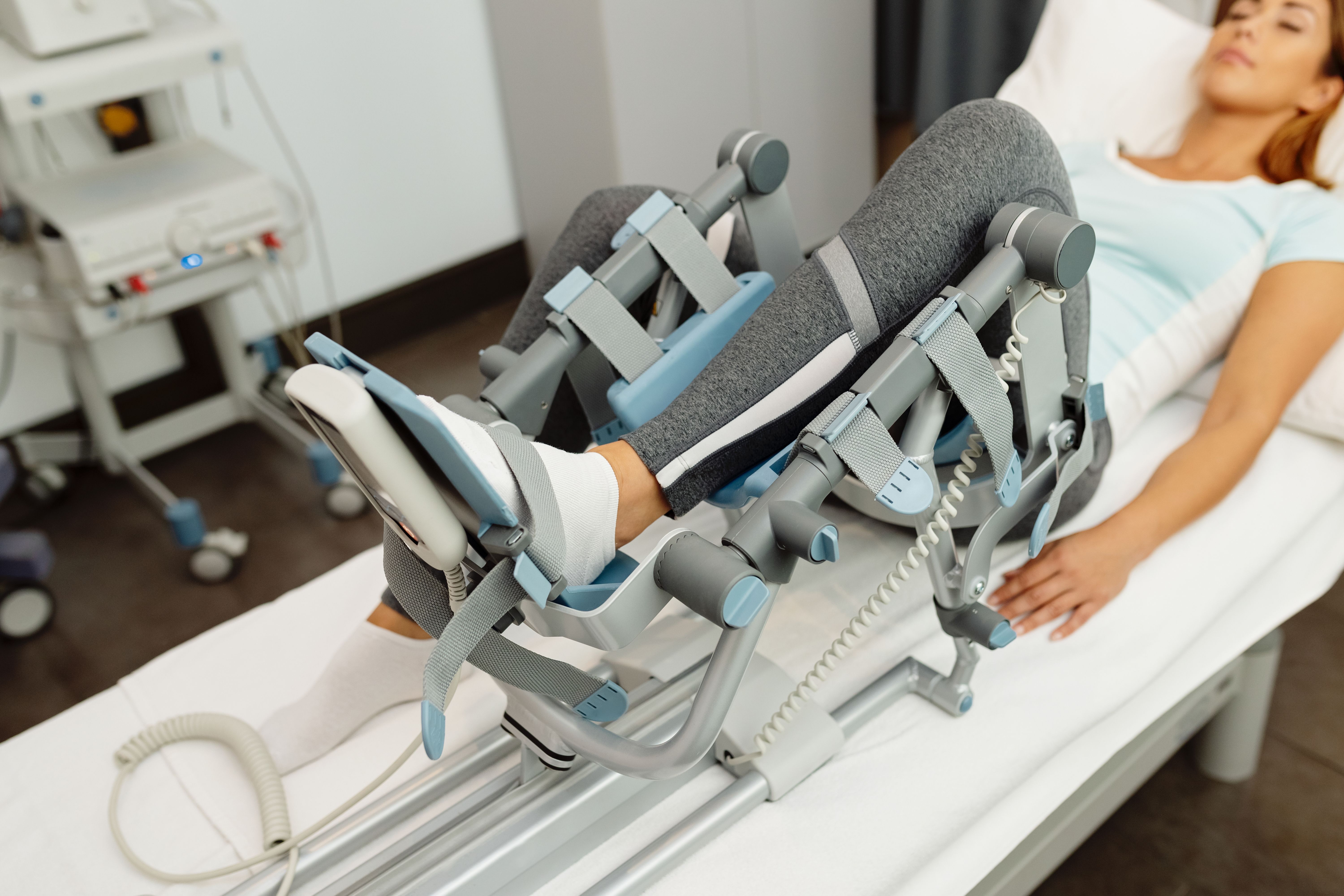 closeup-woman-physical-rehabilitation-with-arthromot-device.jpg