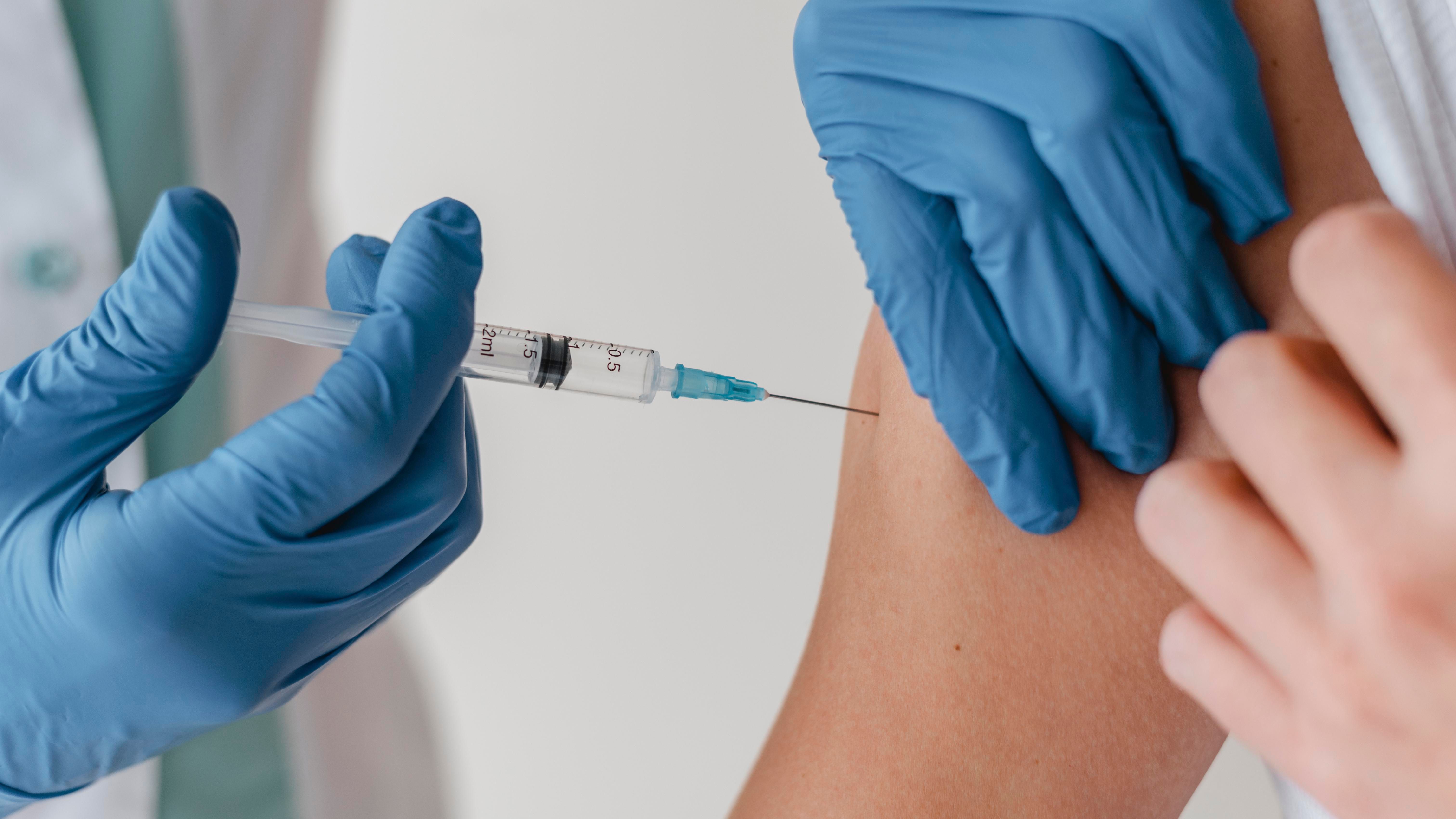 doctor-with-gloves-vaccinating-patient.jpg