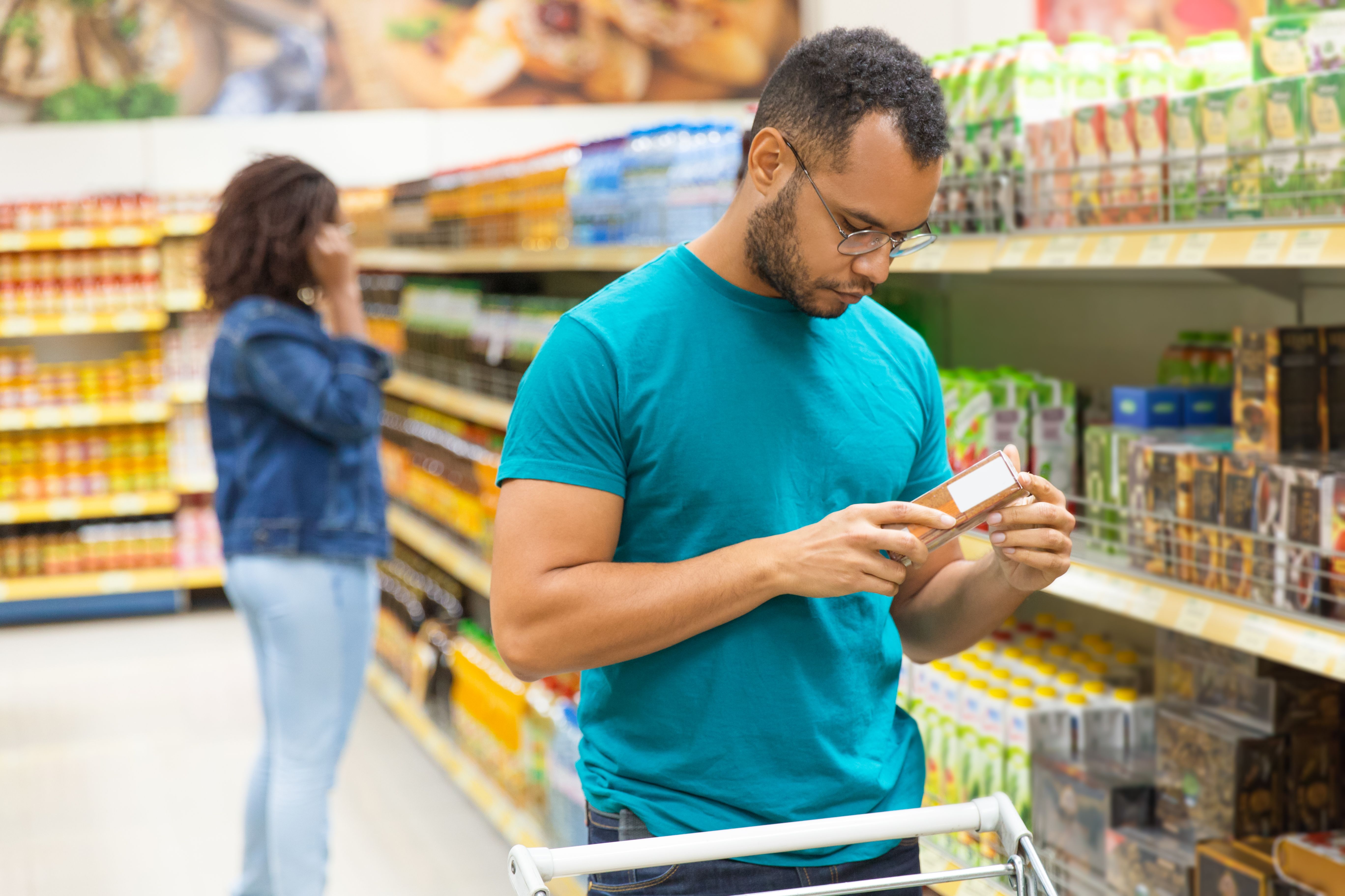 focused-african-american-man-reading-information-packaging.jpg