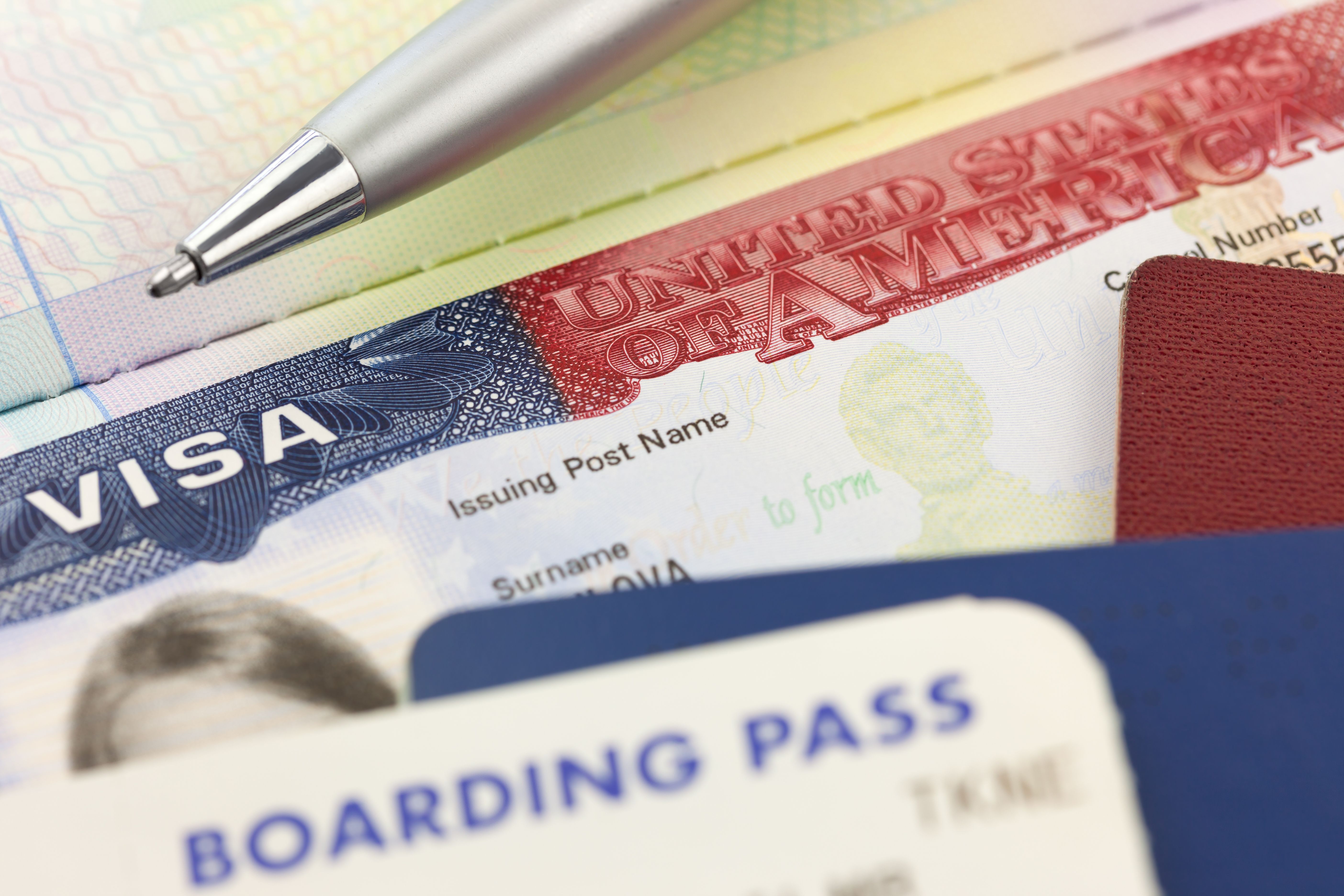 usa-visa-passports-boarding-pass-pen-foreign-travel.jpg